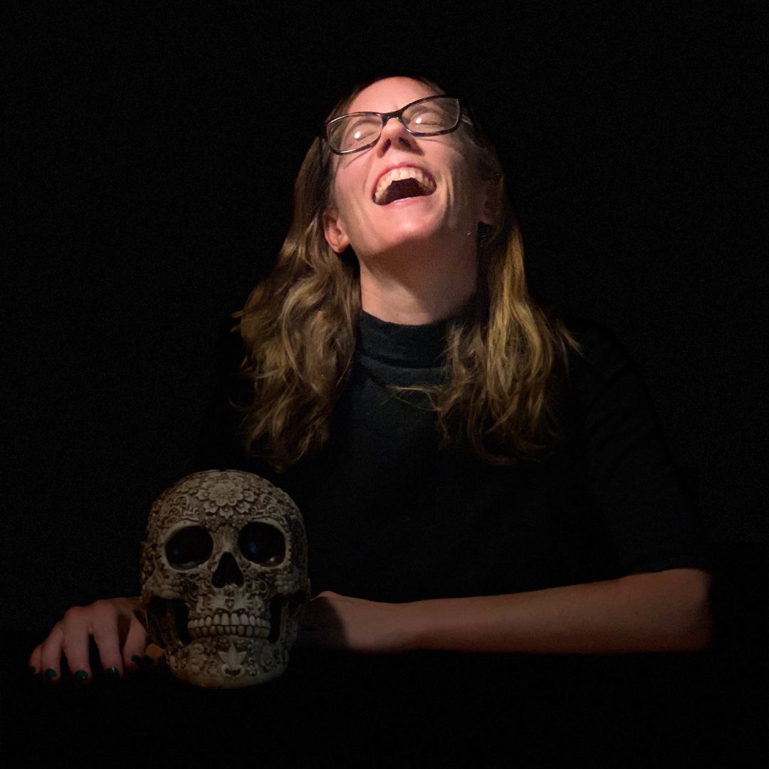 Ritchey laughing and holding a skull