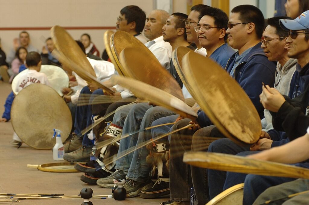 Group of Inupiat people drumming